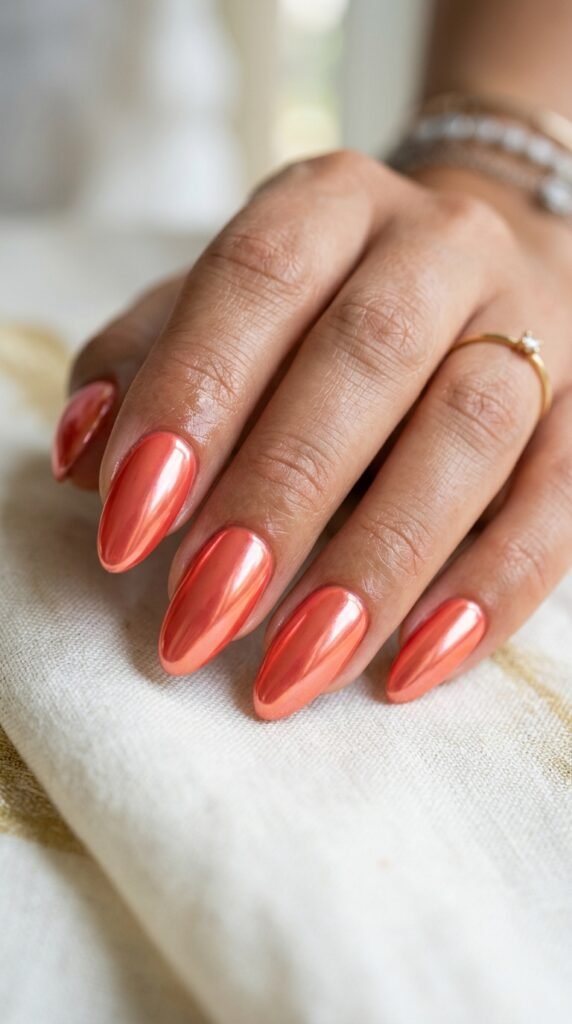 The Glossy Almond Coral Chrome Nail Art